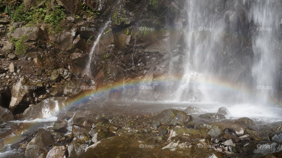 incredible rainbow in a waterfall