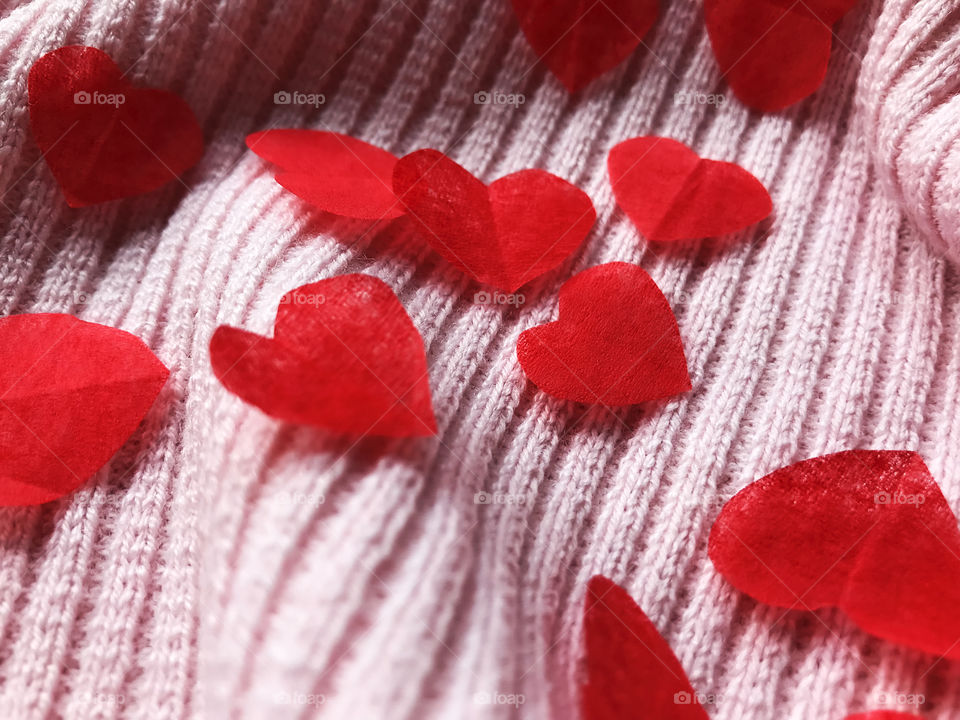 Red hearts on pink background 