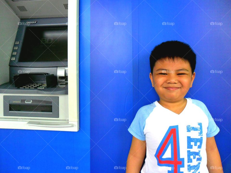 young asian kid smiling at the camera