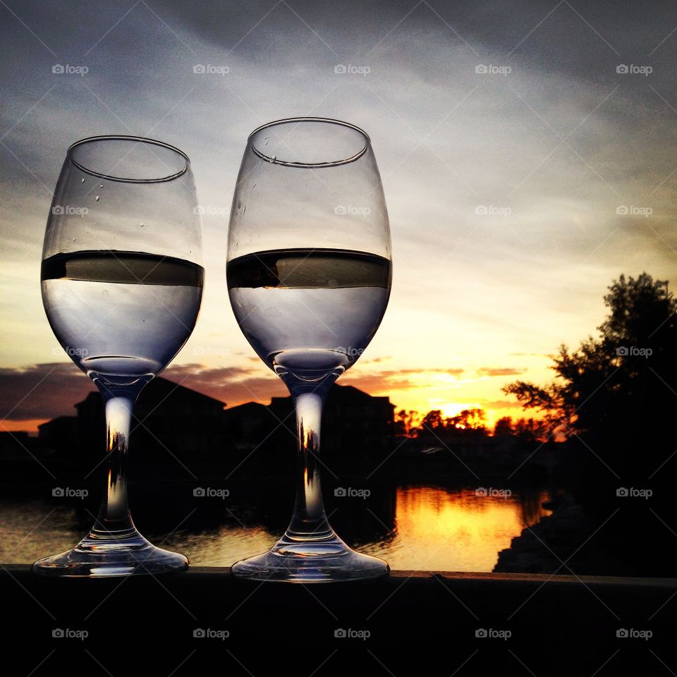 A glass of wine at sunset 