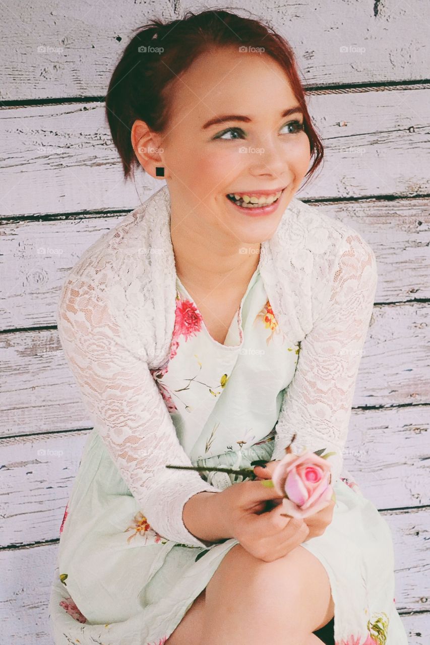 Happy girl smiling in flower dress