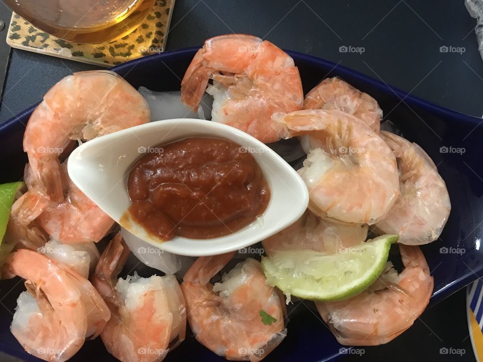 Fresh jumbo shrimp wirh lime a d beautiful cocktail sauce