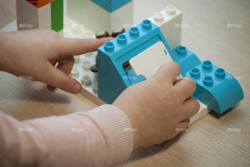 Child playing with toys outdoors