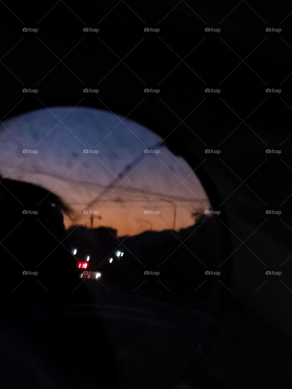 Sky in the rear view mirror