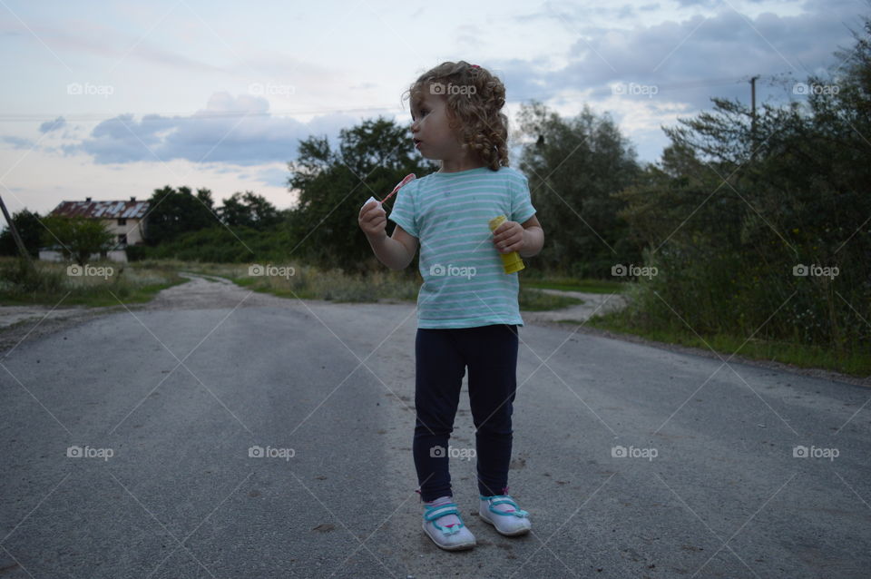 Girl trying to makes bubbles