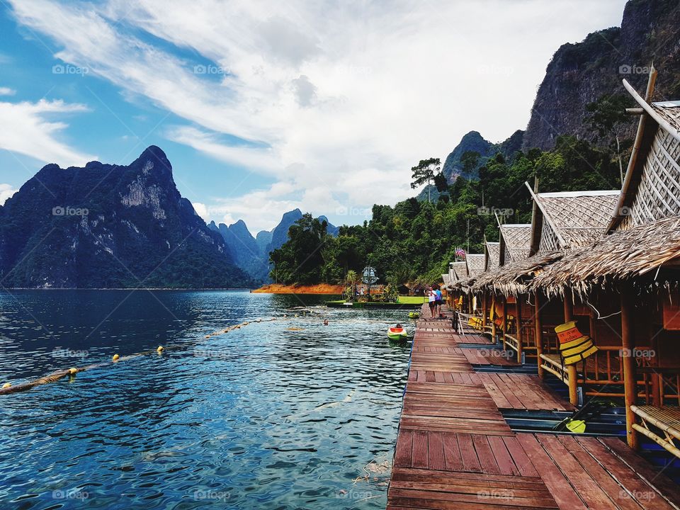 Scenic view of lake against limestone mountain