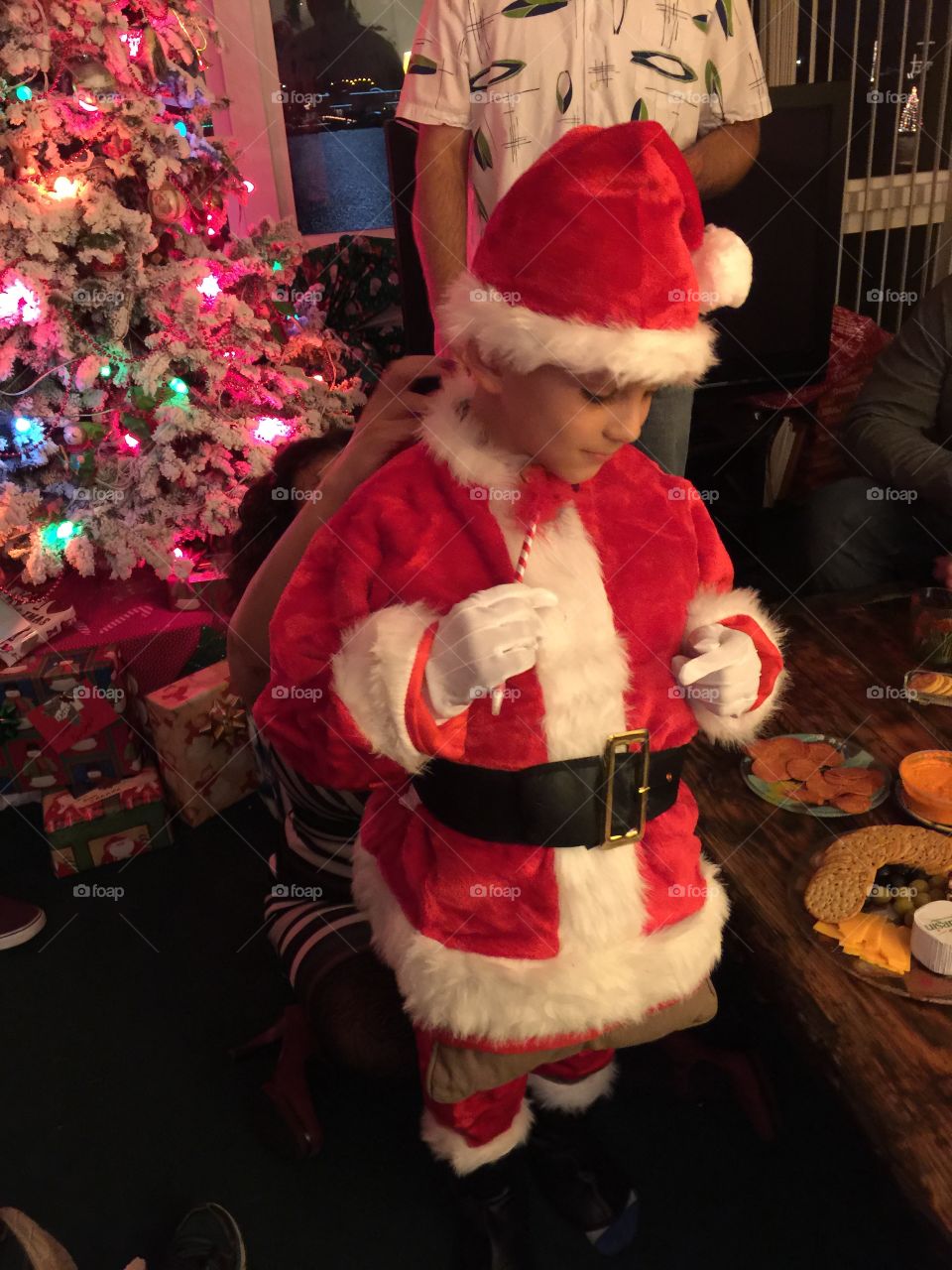 Child dressing up as Santa