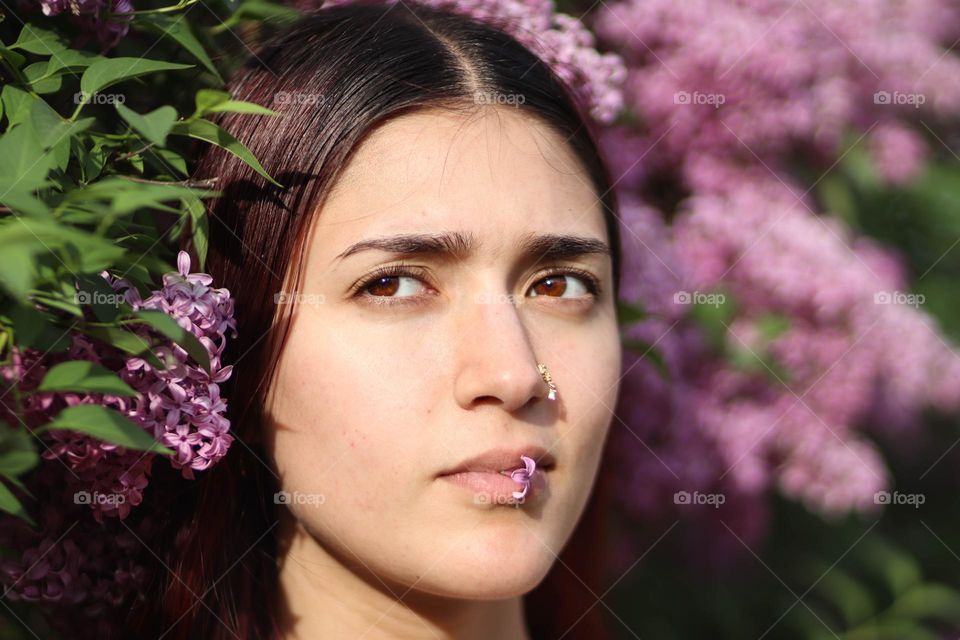 Beautiful Afghani woman in flowers