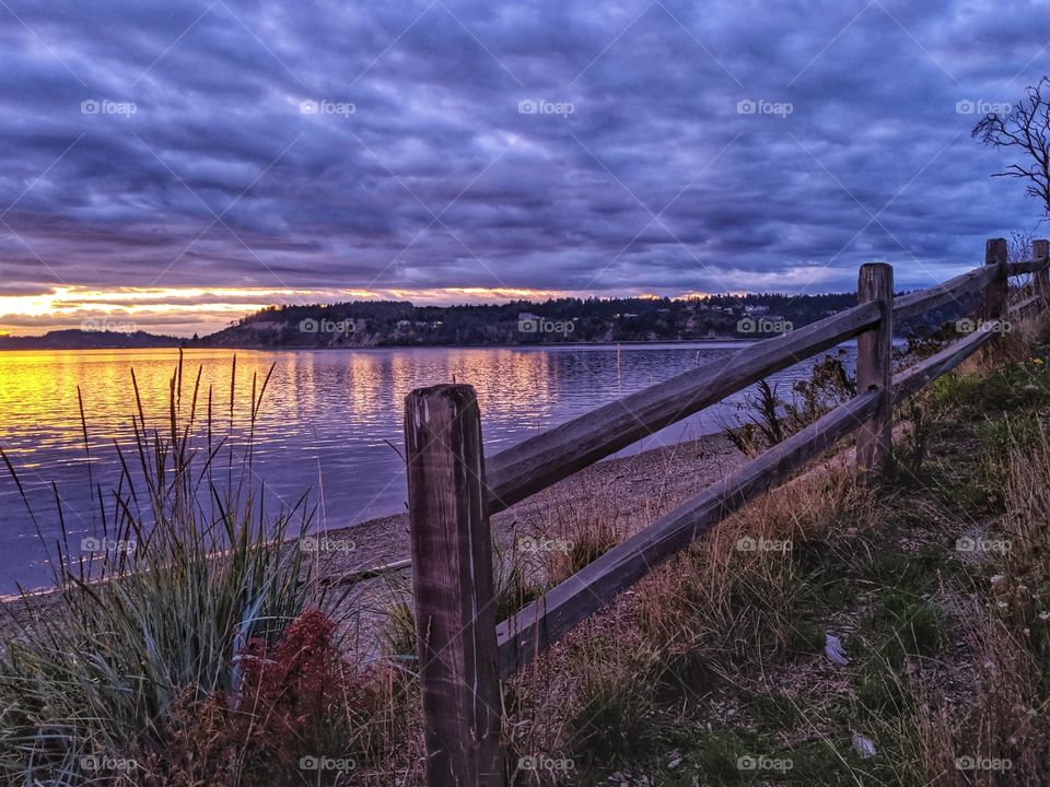 Nature's amazing, bold and colorful sunset captured with all the clouds at the beach.