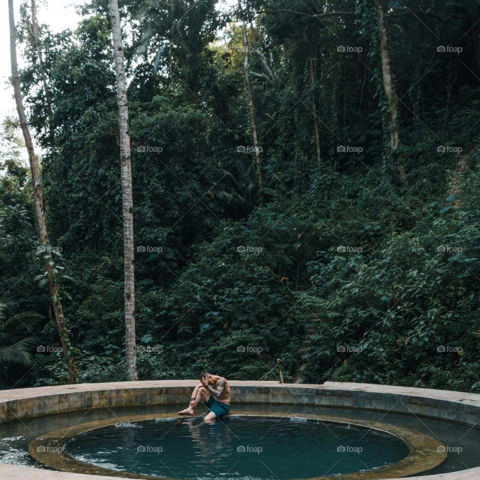 Man in sitting pool