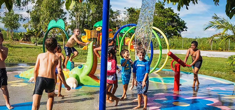 Crowd at the Waterpark: A group of children playing