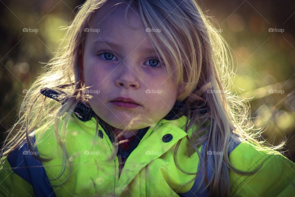 Girl. Girl sitting among grass .... Psst she played the fairy :)