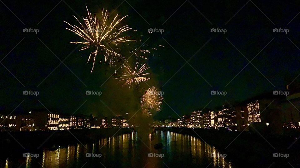 Fireworks above river 