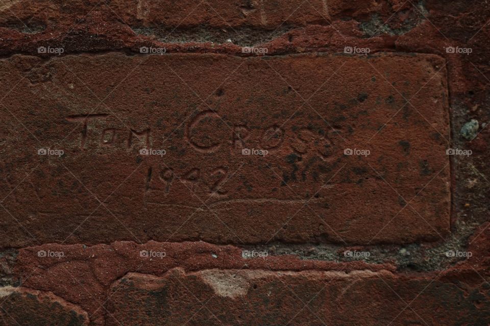 engraving on brick wall