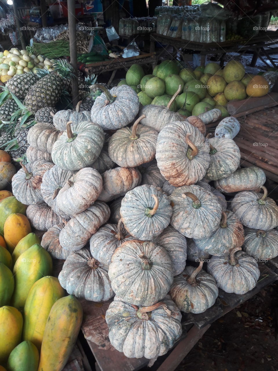 Vegetable and Fruits at Jungle Market ; pumpkin , papaya , pineapple