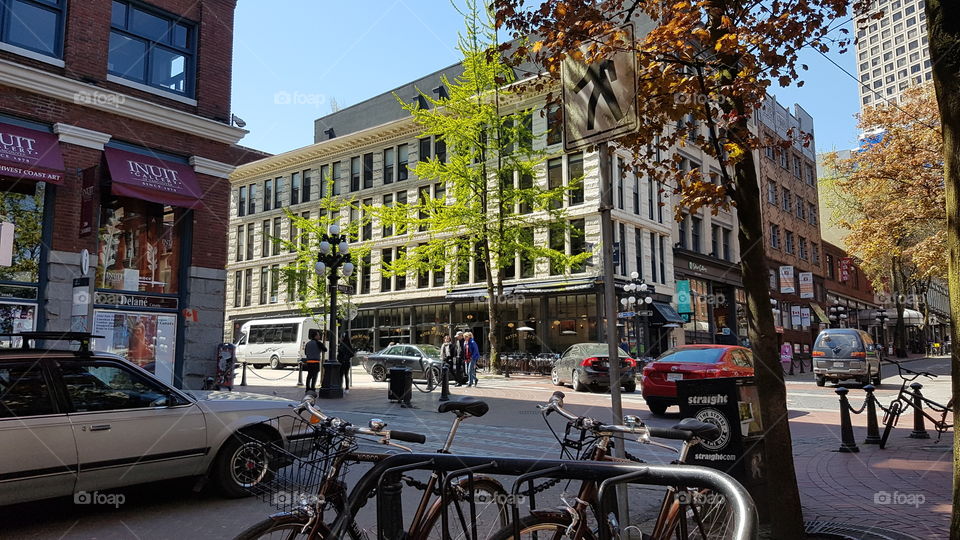 busy streetscape with cars and old buldings