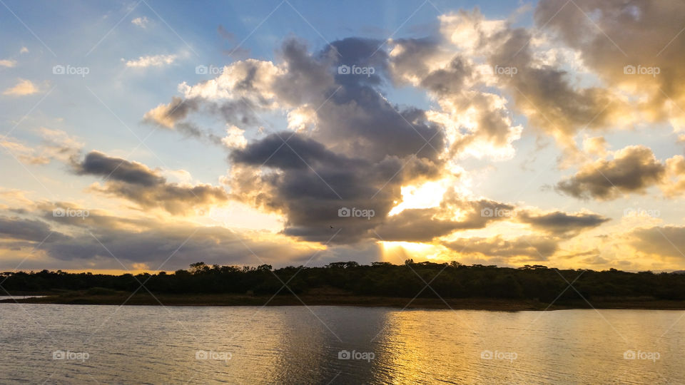 sunset behind clouds