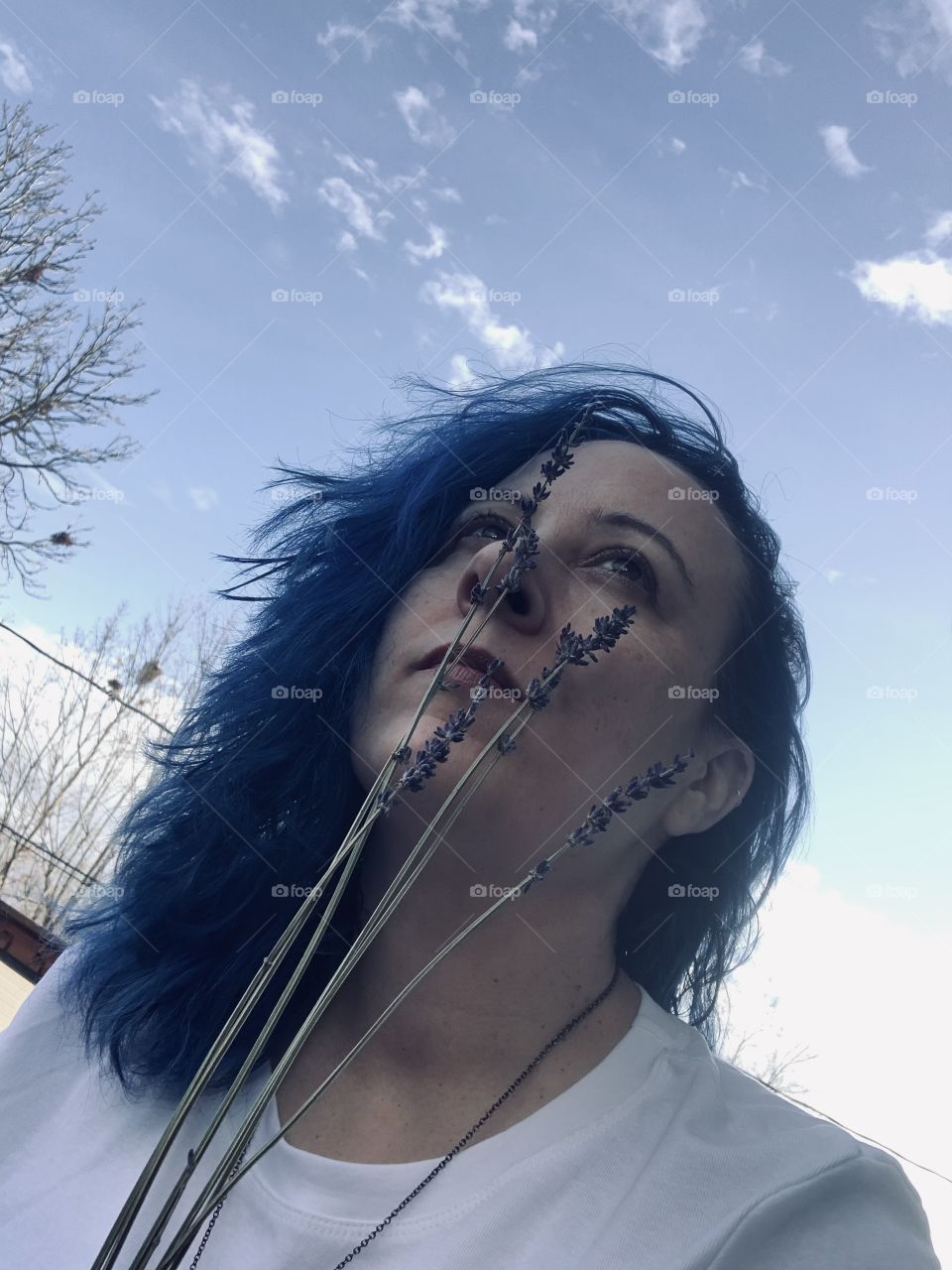 A study in blue. Blue clouds, blue hair, and blue(ish) flowers. The cold weather can also make one blue. 