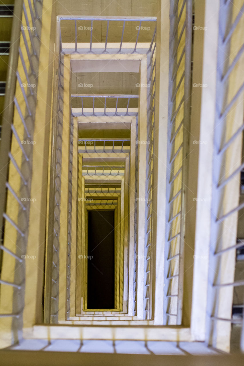 Like these lines and shapes of an image of a rectangular staircase with interesting light and shadows