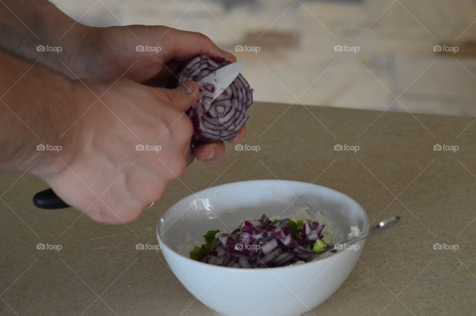 Close-up of man's hand preparing food