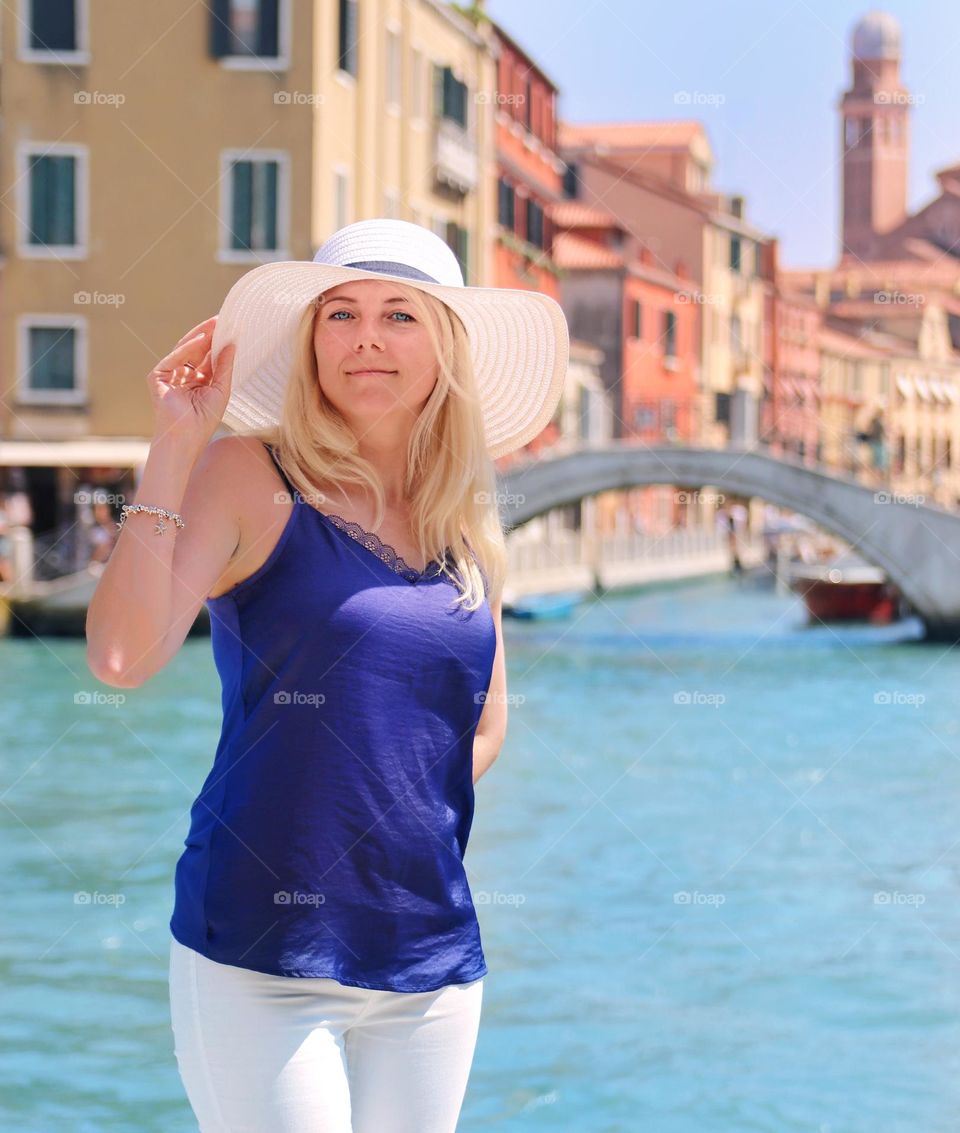 young woman with hat in venice in summer
