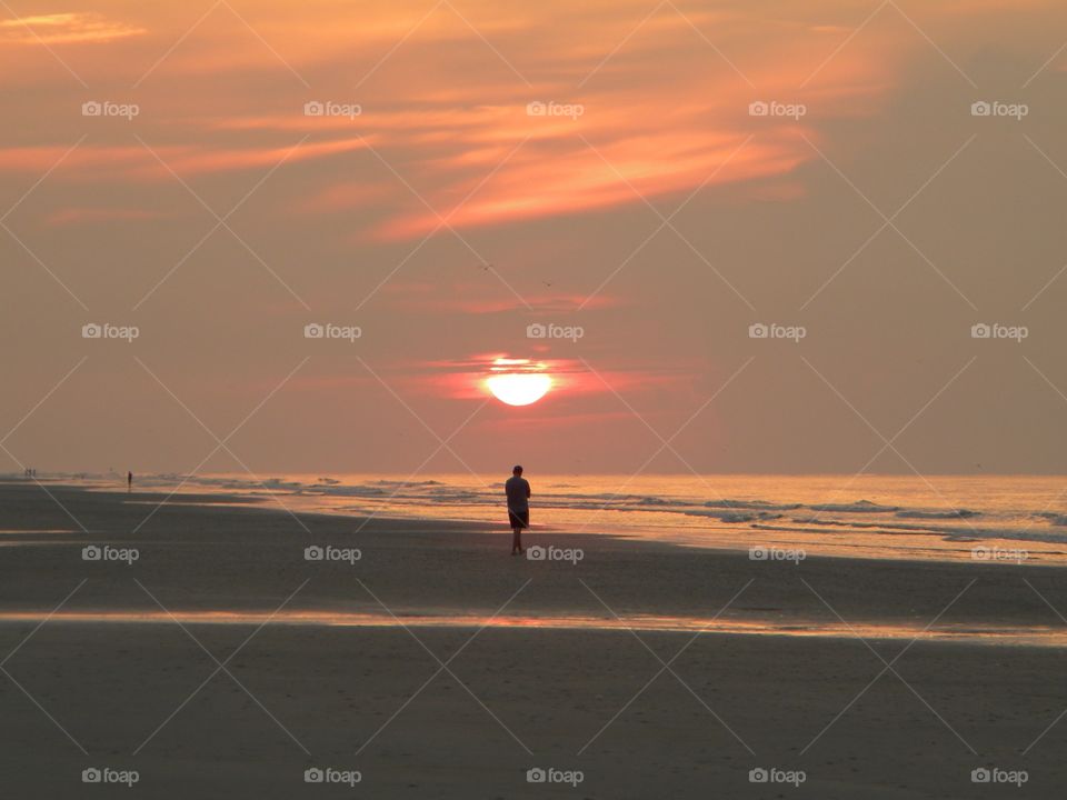 A sunrise walk on the beach 