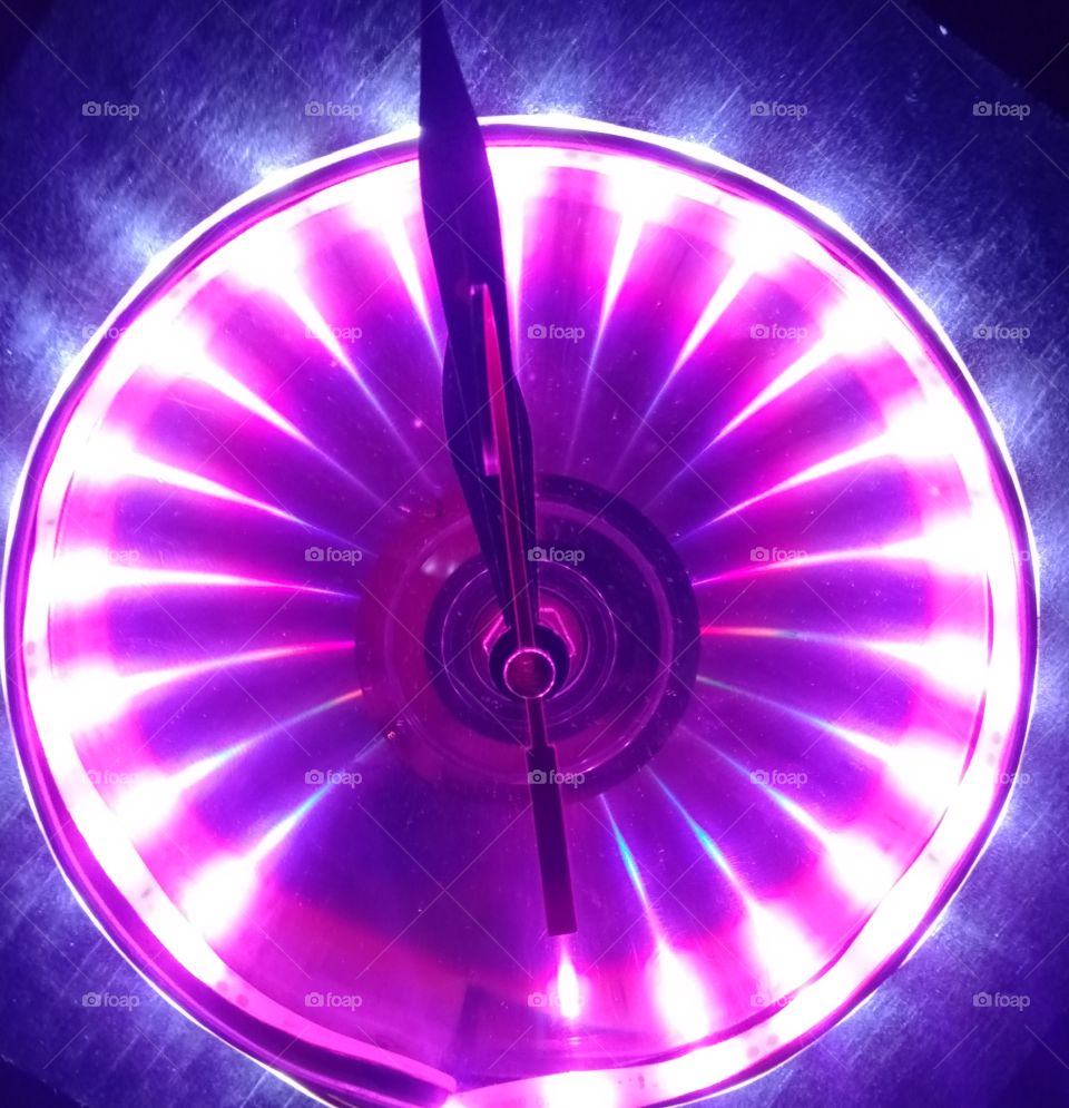 This table clock looks soft and beautiful with a striking color because it uses a led strip and a compact disc