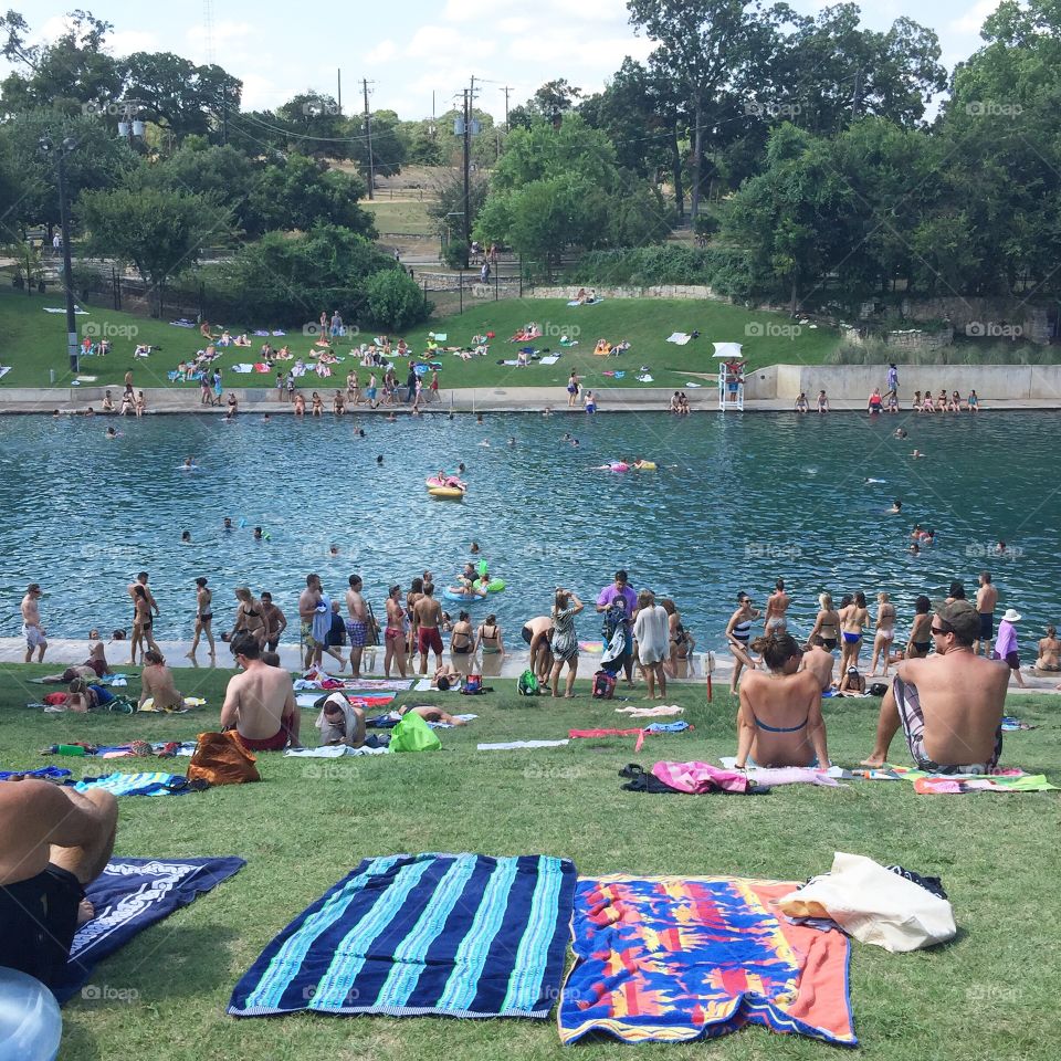 Sunbathers at Barton Springs pool in Austin, Texas