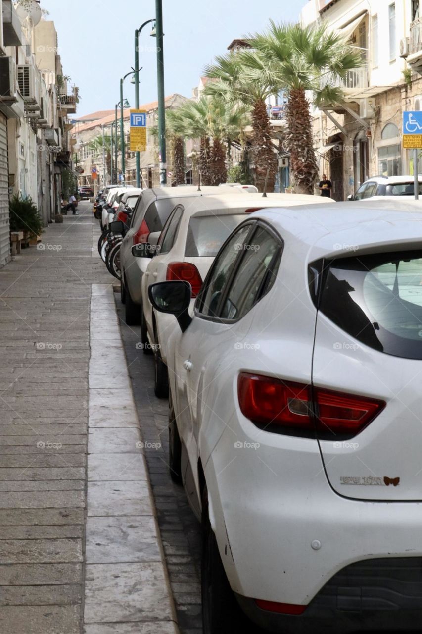 Cars parking in small street in the city