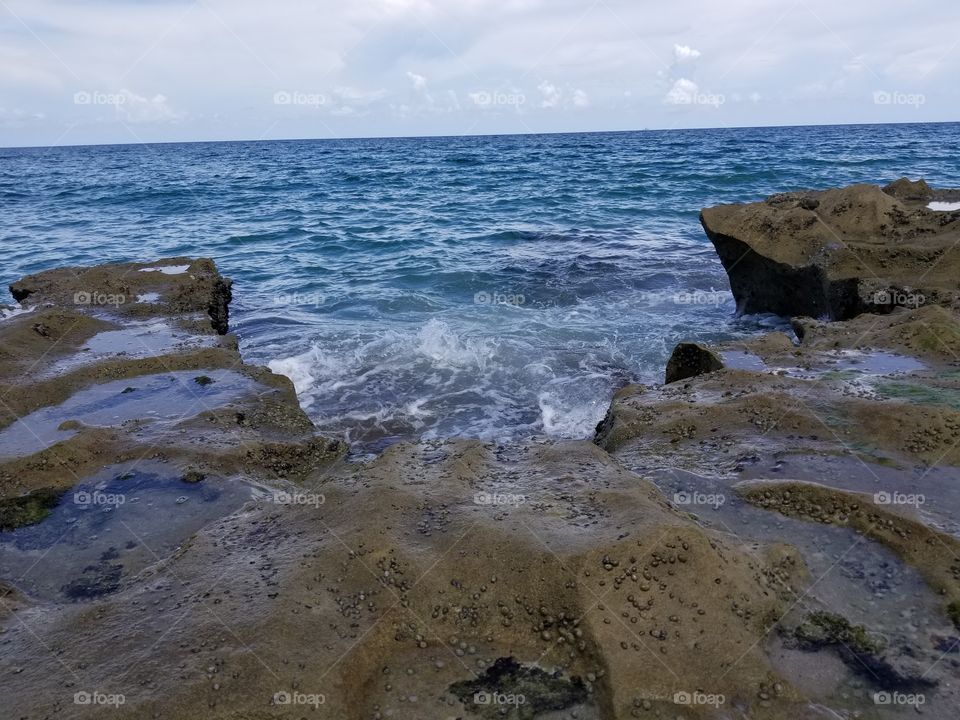 waves crashing on rock