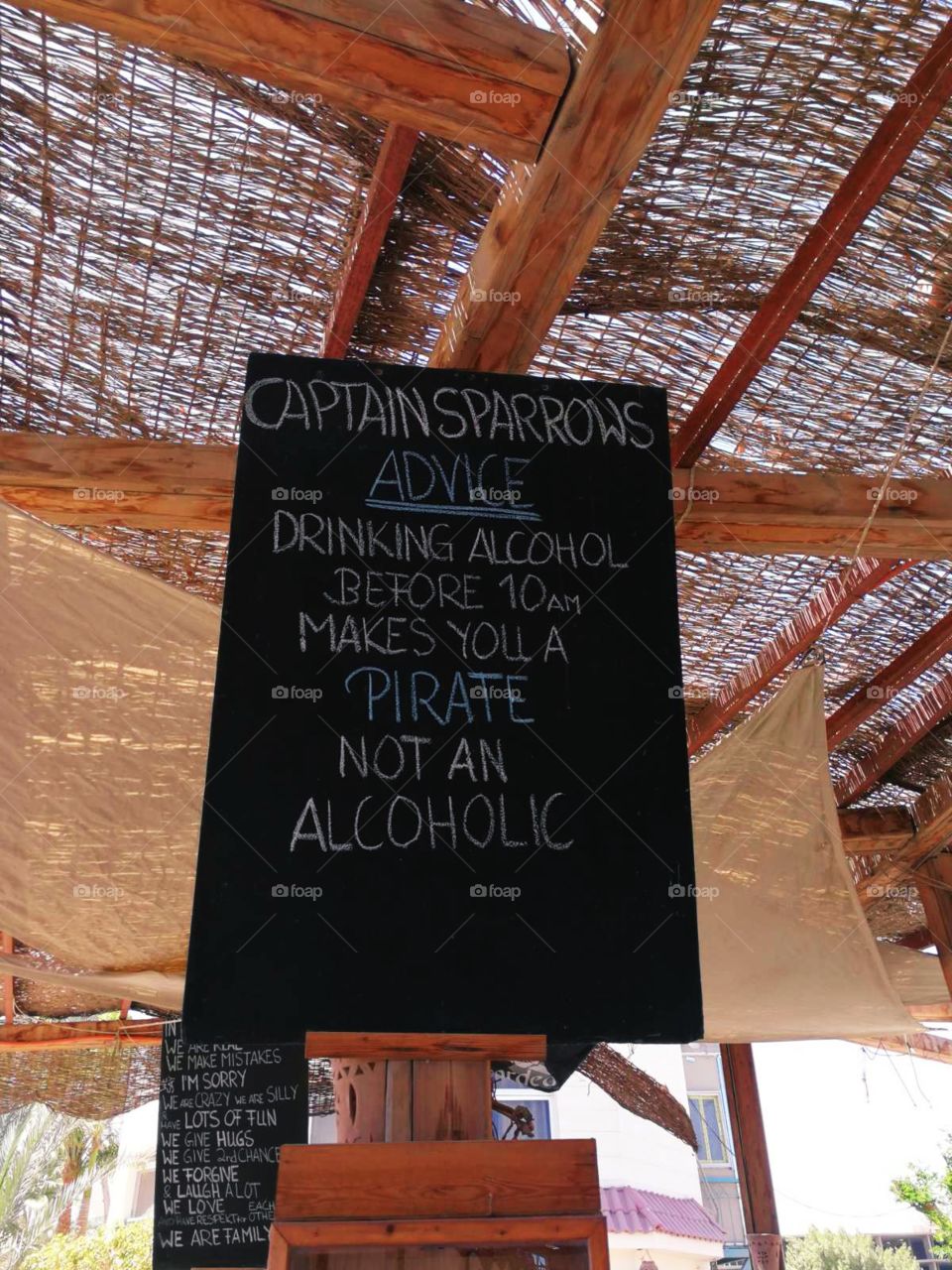 A funny Captain Sparrows advice on the black board in a beach bar.