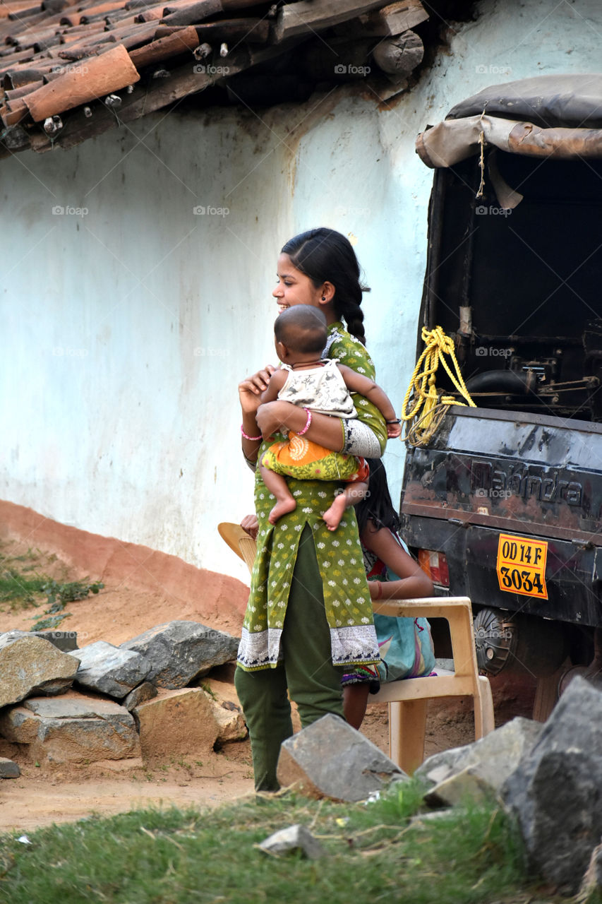 Indian girl with her child
