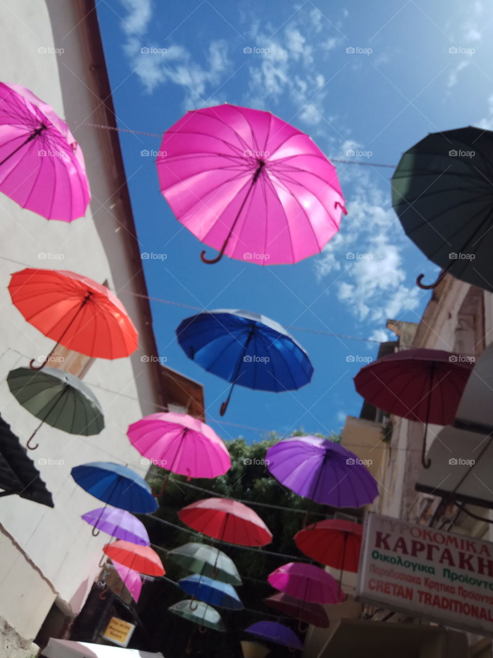 umbrelas in colors flying in the street