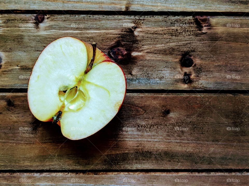 An apple on a wooden background