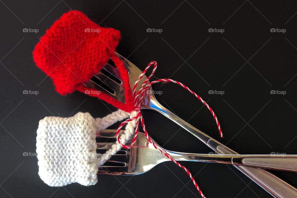 Forks Martenitsa. A Martenitsa is a piece of adornment, made of white and red yarn and usually in the form of two dolls, a white male and a red female. Every year on 1st of Martch, Bulgarian people exchange Martenitsa for health and good luck