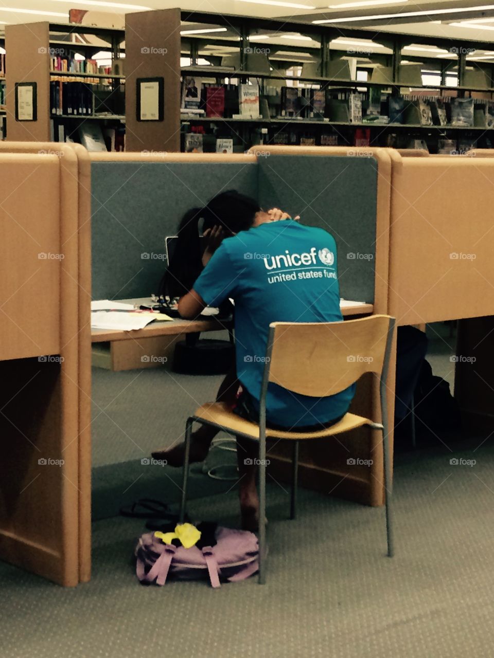 Studying in library. Student