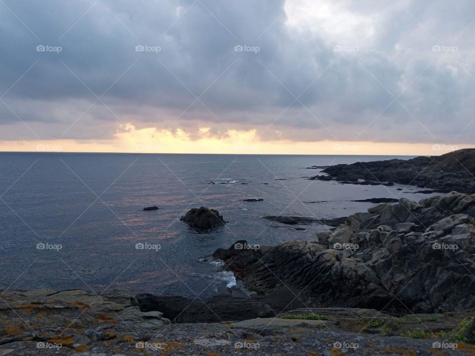 Beautiful scenery of the Black Sea coast in the sunrise in Bulgaria, with rocks, beaches, clouds and waves