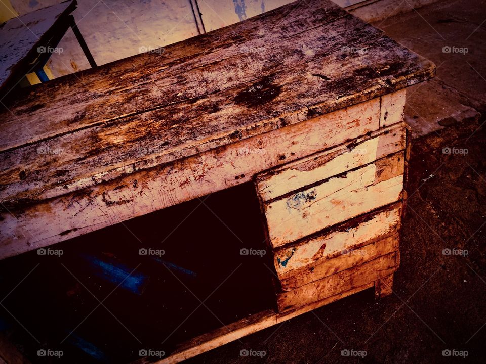 Damaged bench at the road side of the temple 
