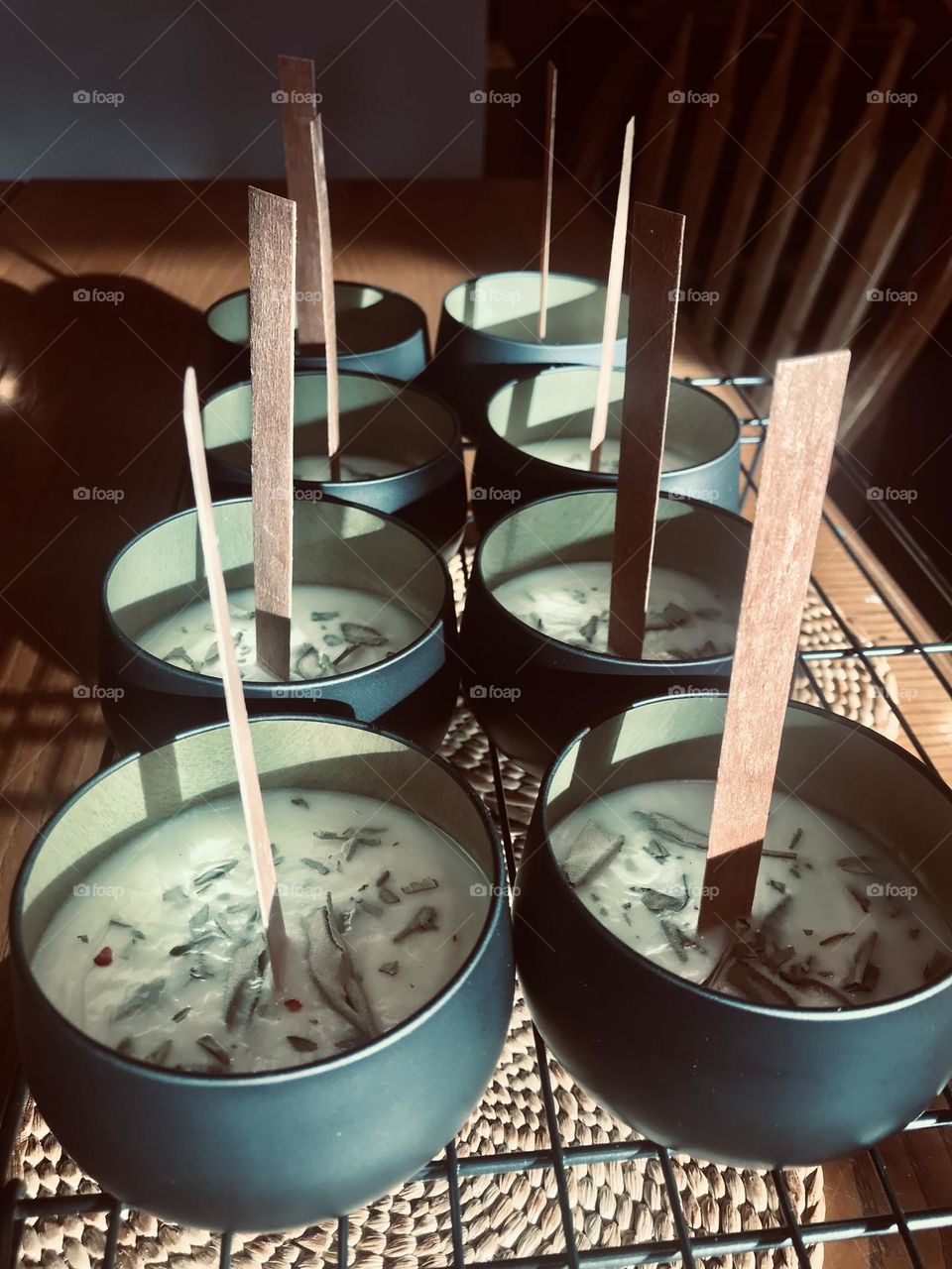 Candles on a cooling rack in natural light