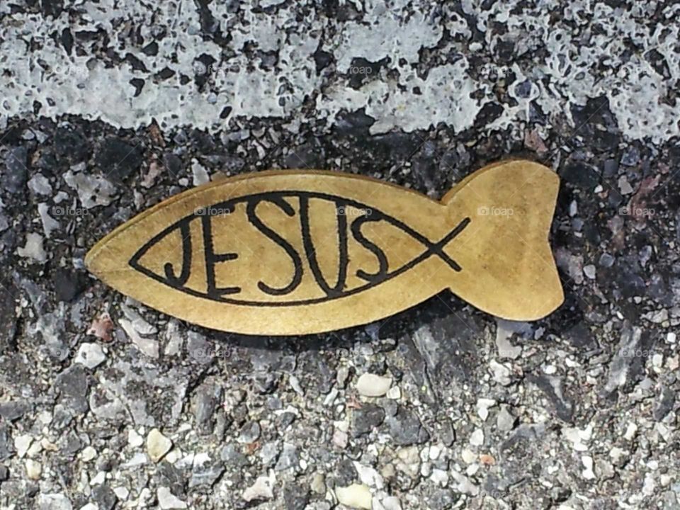 Jesus fish, wooden, asphalt
