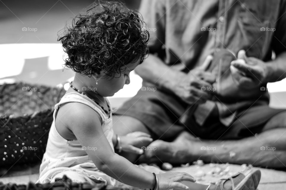 Child helping elder.