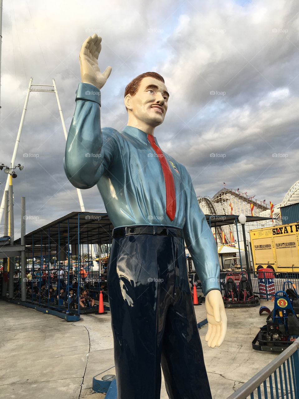 Howdy!  Very tall statue of a man that greets you at the entrance to an amusement park. 