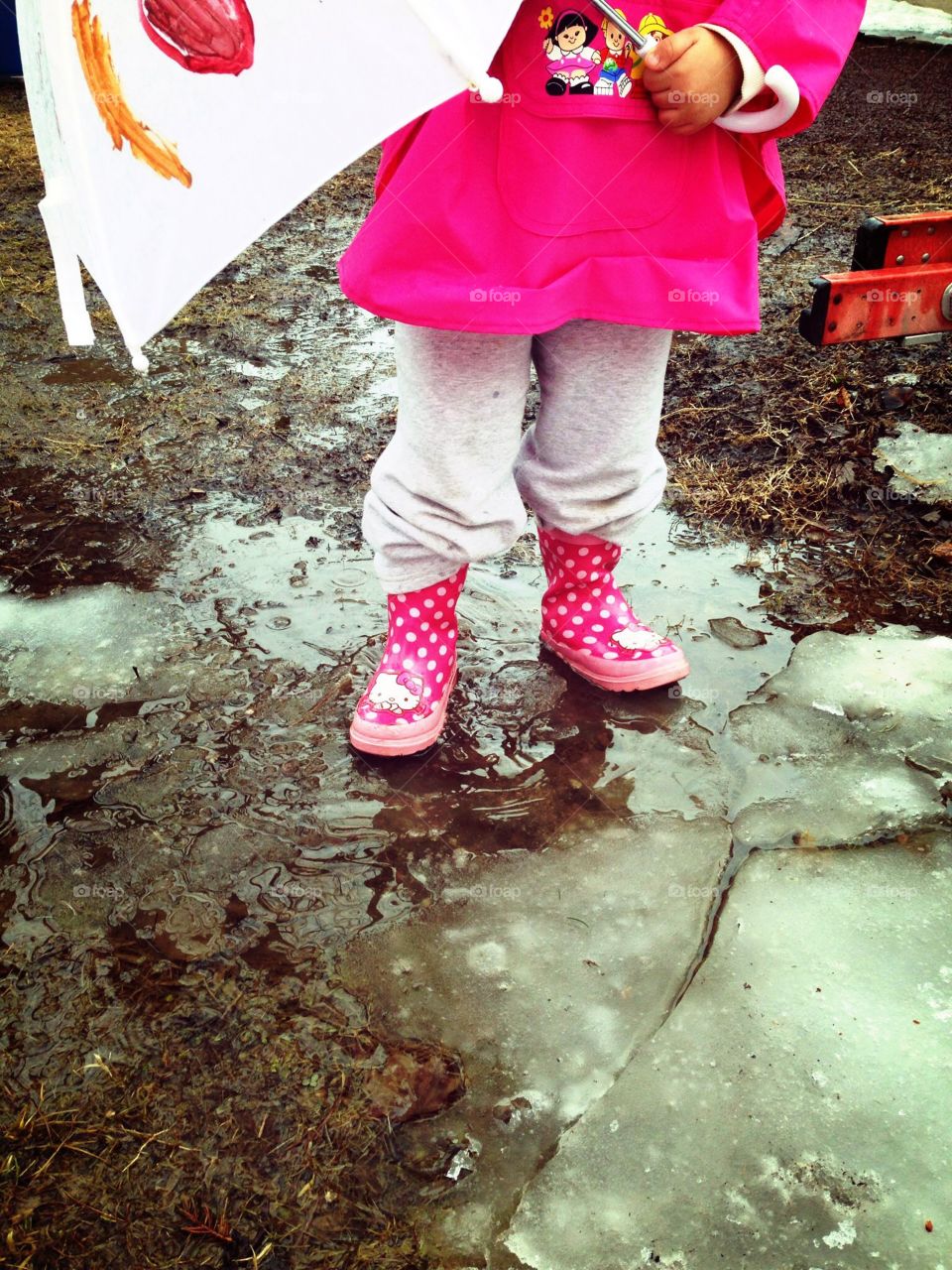 Rain boots. Child in the rain