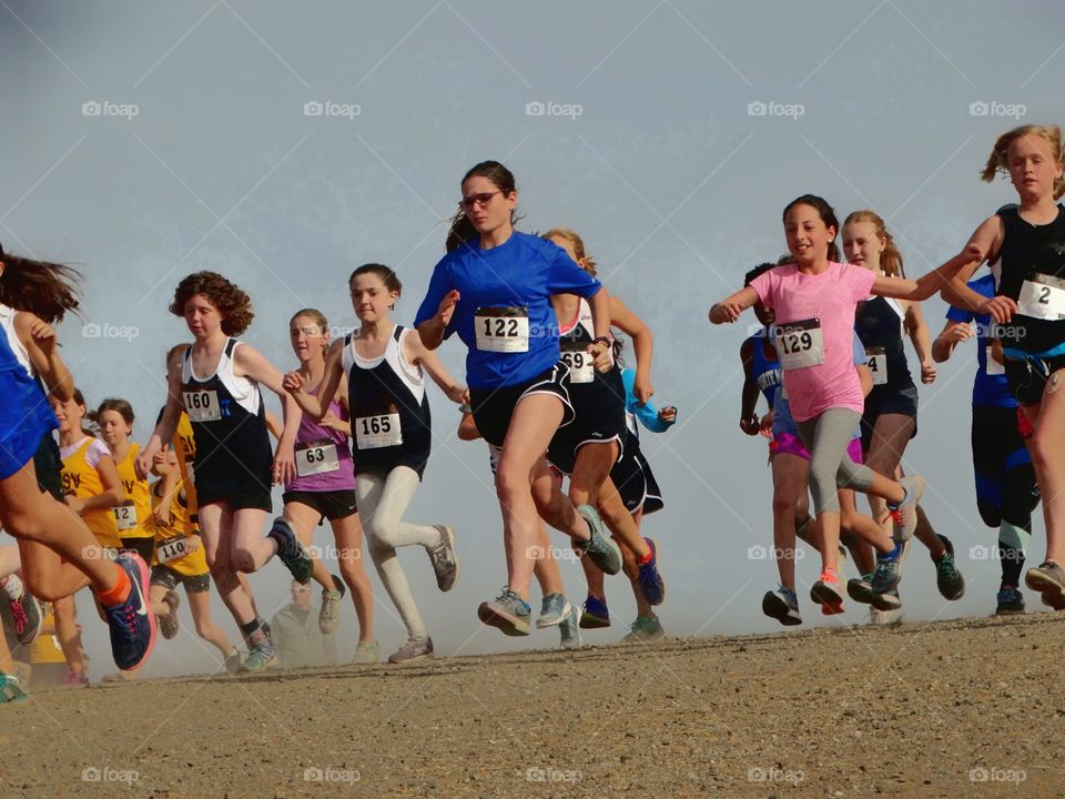 Girls Running In A School Track Meet