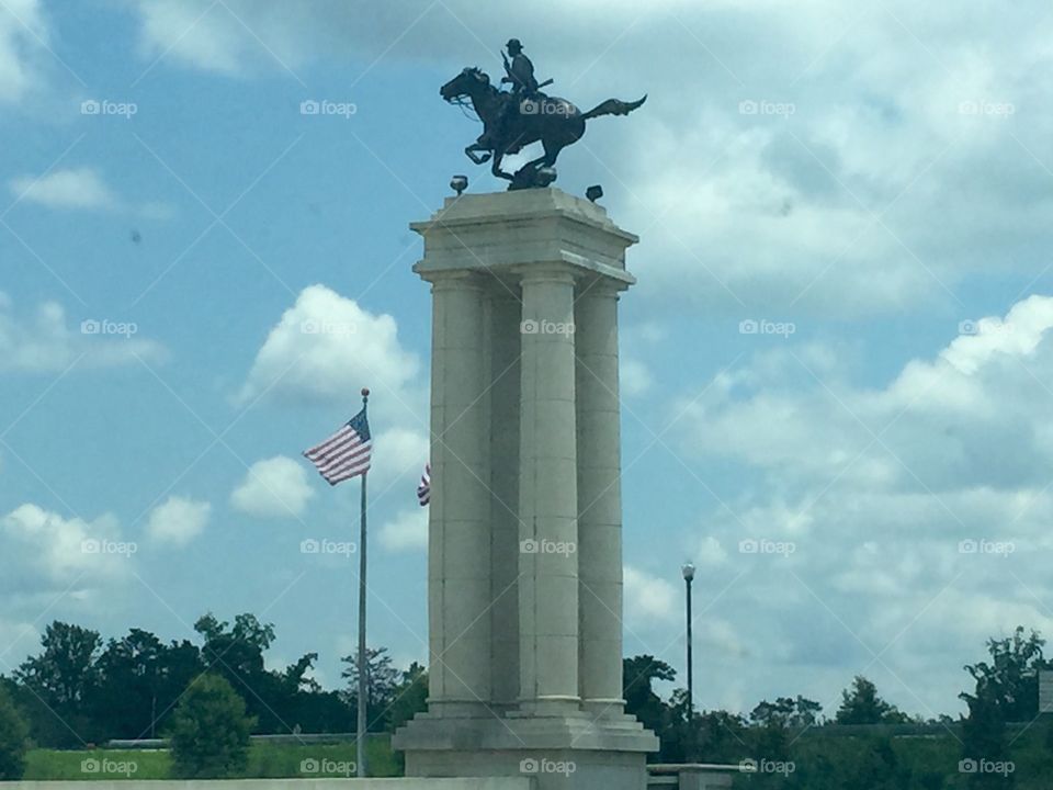 A stone pillar with a horse statue at the top outside Fort Benning  in Columbus, Georgia.