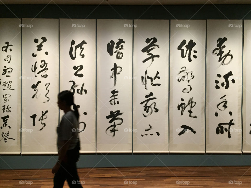 A women silhouette with Chinese calligraphy background in Singapore 