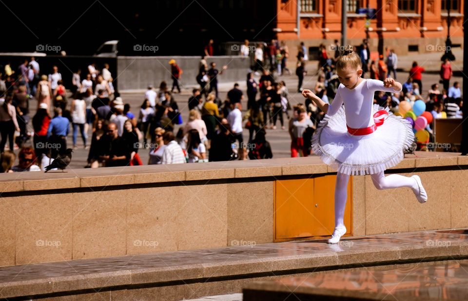 little ballerina dancing on the street