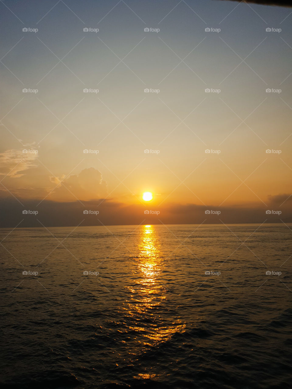 Sunrise is seen from the ship