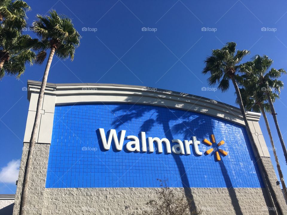 Walmart sign and palm trees 