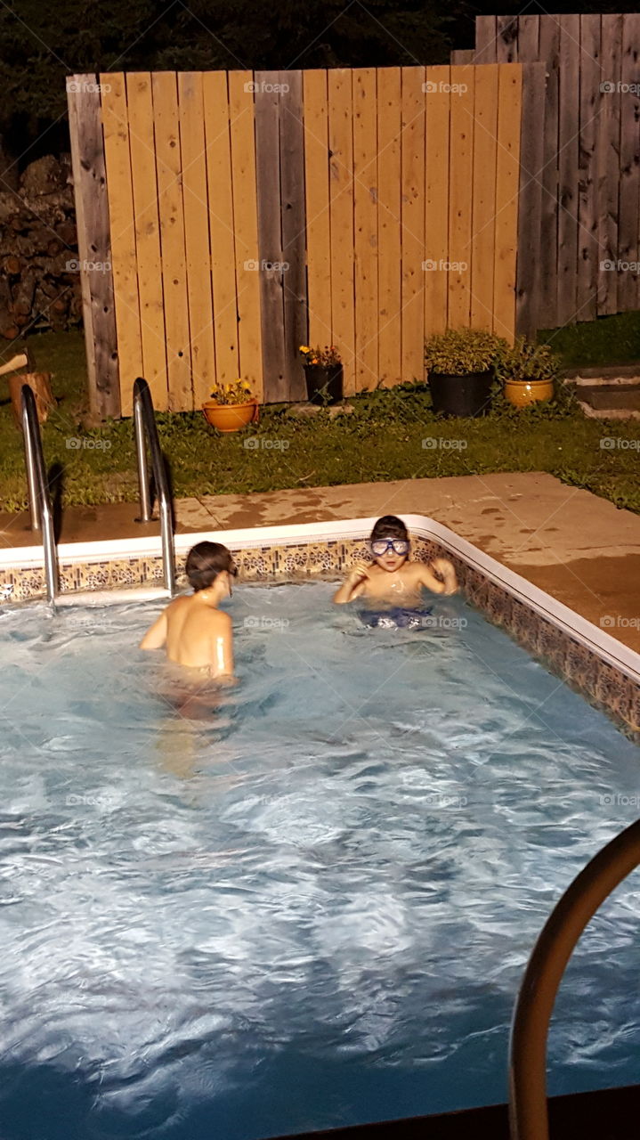 Late Night Splashes. our last full weekend for the pool. the boys are taking every minute the can!